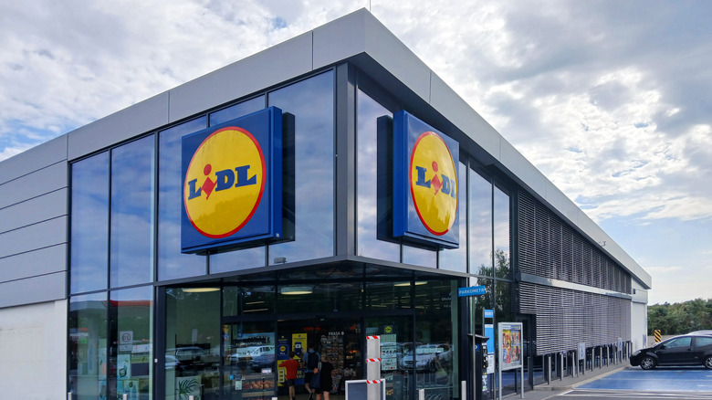 The outside of a Lidl building with two Lidl signs