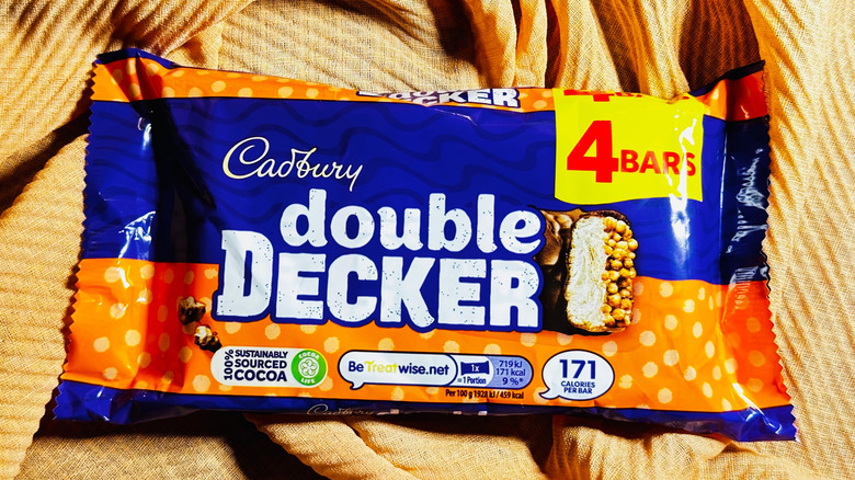 Multipack of Cadbury Double Decker chocolate bars displayed on fabric background