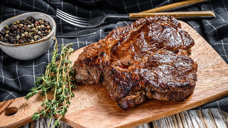 grilled chuck eye steak on a cutting board