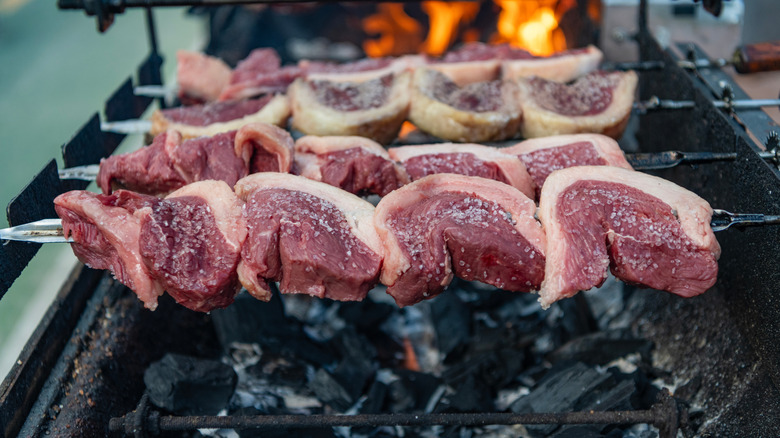 picanha being roasted over hot coals