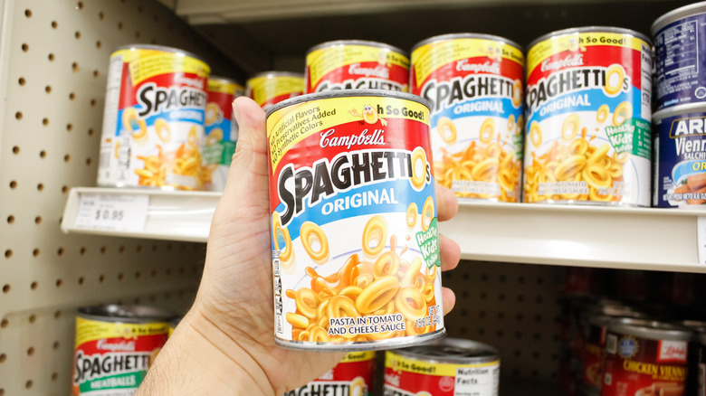 Person holding can of SpaghettiOs
