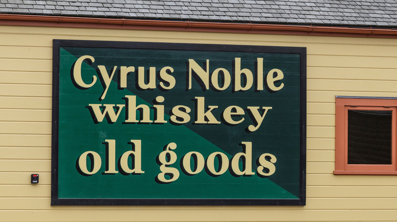 Cyrus Noble whiskey sign on side of building