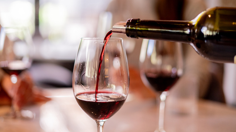 Red wine being poured into a glass