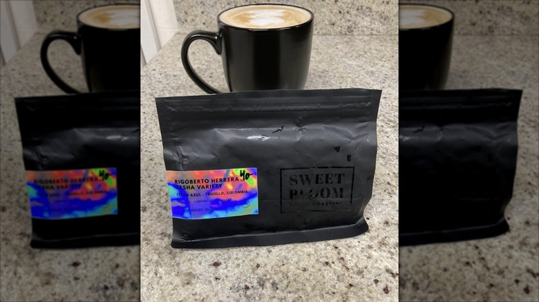 Bag of beans and mug of coffee from Sweet Bloom Coffee Roasters