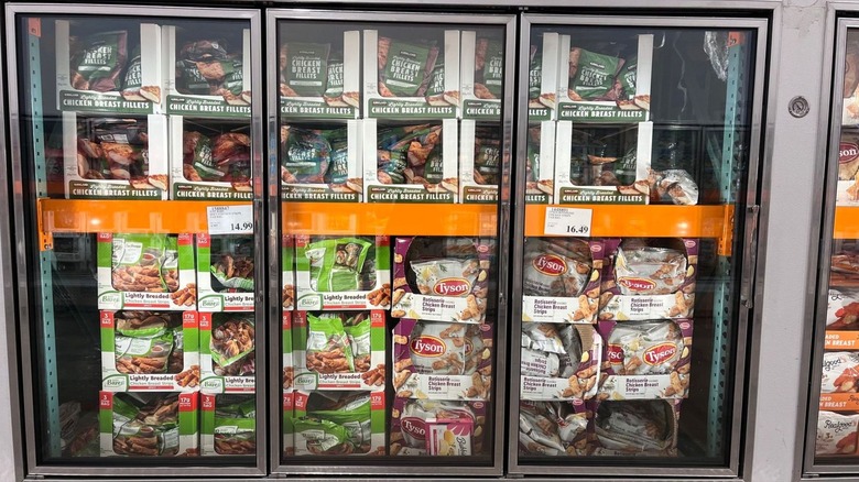 Frozen aisle at Costco with products like Kirkland Signature chicken breast fillets
