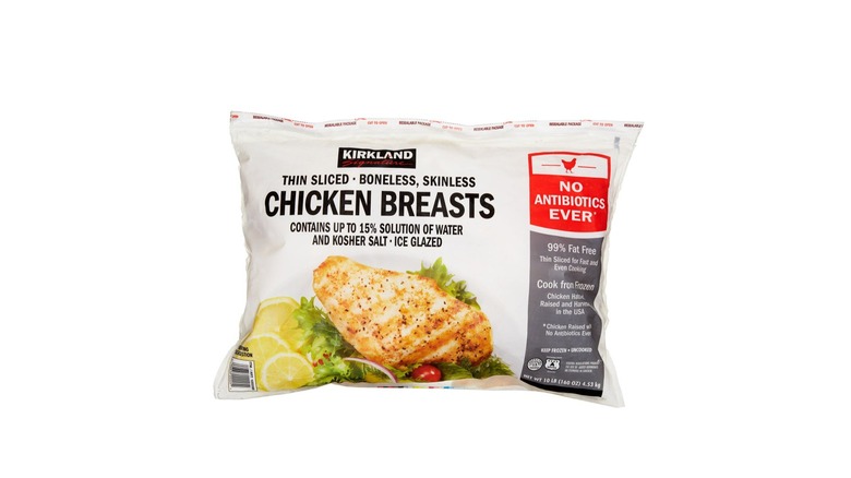 Product image of bag of Kirkland Signature frozen chicken breasts on a white background