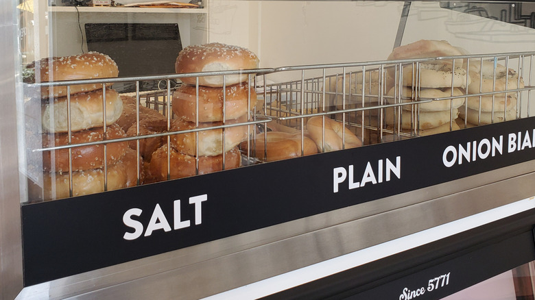 Fresh bagels in deli display case