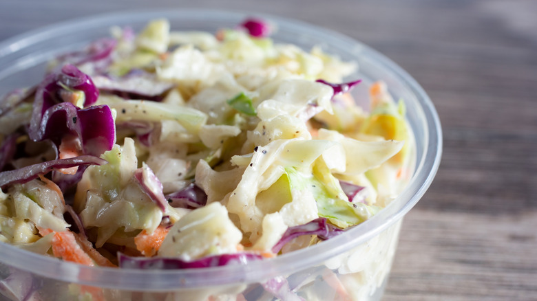 Close-up on plastic cup of coleslaw