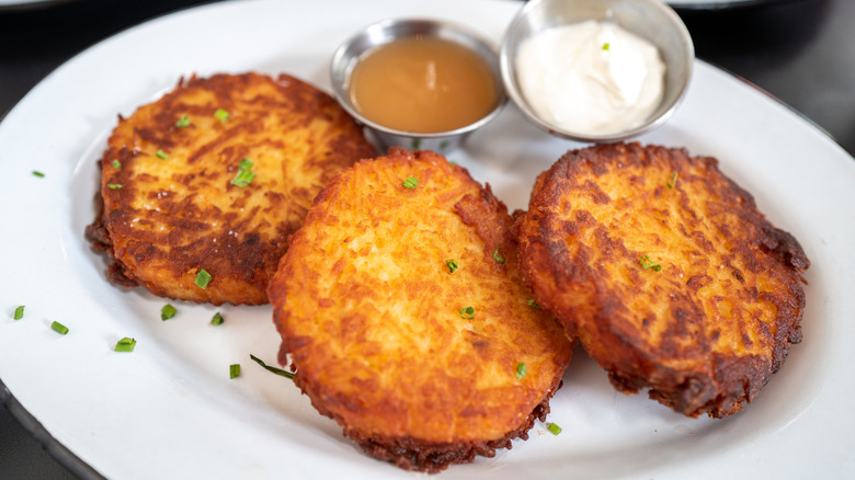Three potato latkes on plate