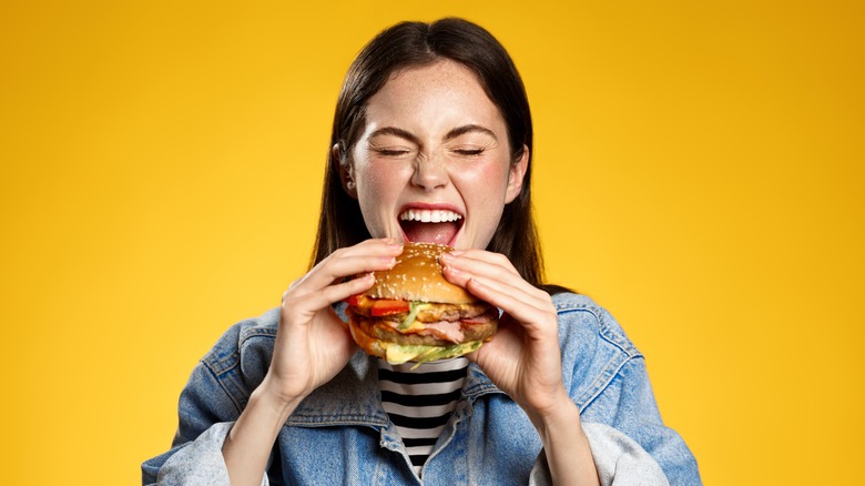 Woman eating a burger