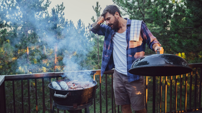 Person looking at grill with dismay