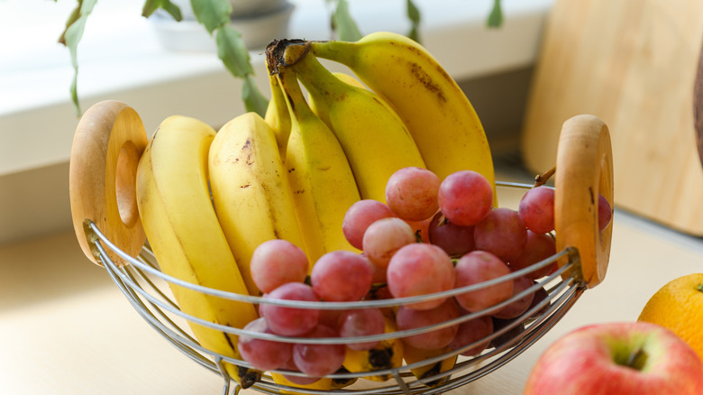 Bananas and grapes in a fruit basket