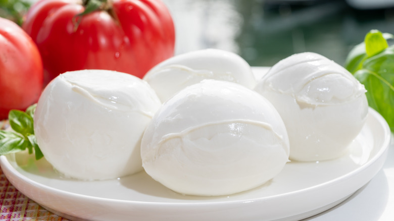 Balls of fresh mozzarella on plate