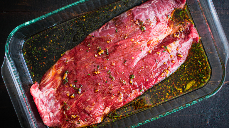 Steak soaking in marinade