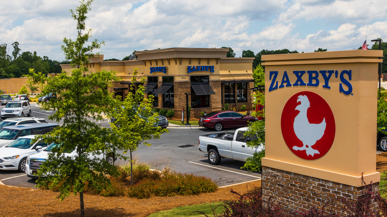 A Zaxby's restaurant with the logo signage in the foreground