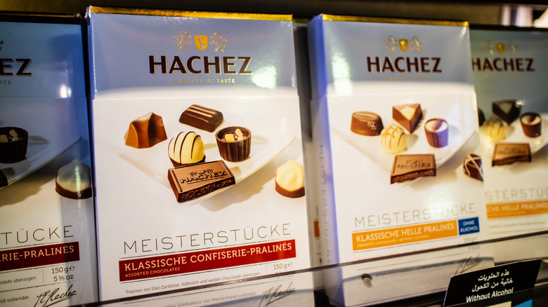 Hand holding Hachez chocolate bar