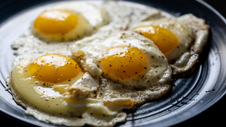 fried eggs with pepper on plate