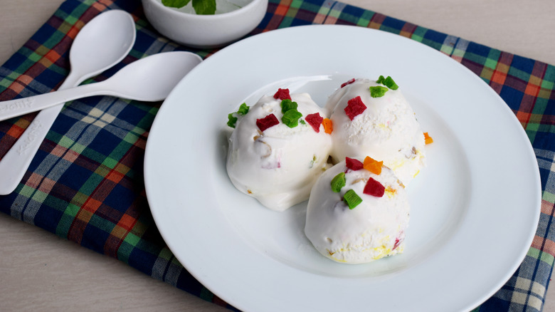 A white plate of tutti frutti ice cream