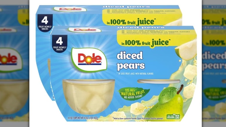 Two packs of Dole sliced pears soaked in juice