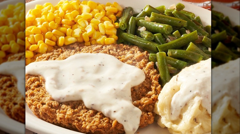 Cracker Barrel country fried steak with mashed potatoes, corn, and green beans
