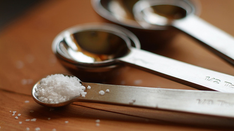 Salt in a measuring spoon