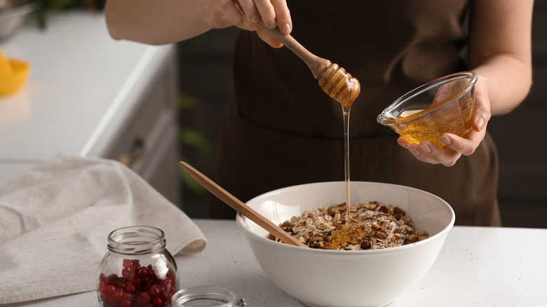 Person mixing honey into recipe