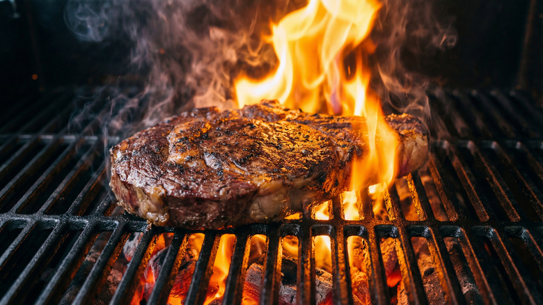 Steak on fire on grill