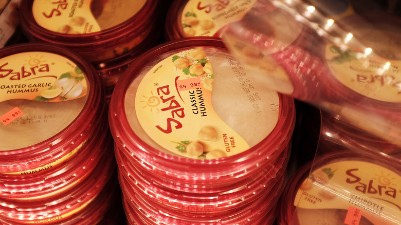 sabra hummus containers on shelves