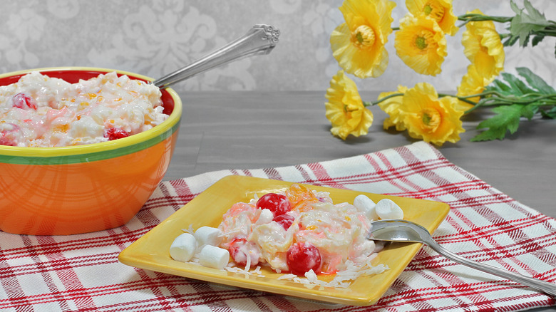 plate of ambrosia salad with bowl in background
