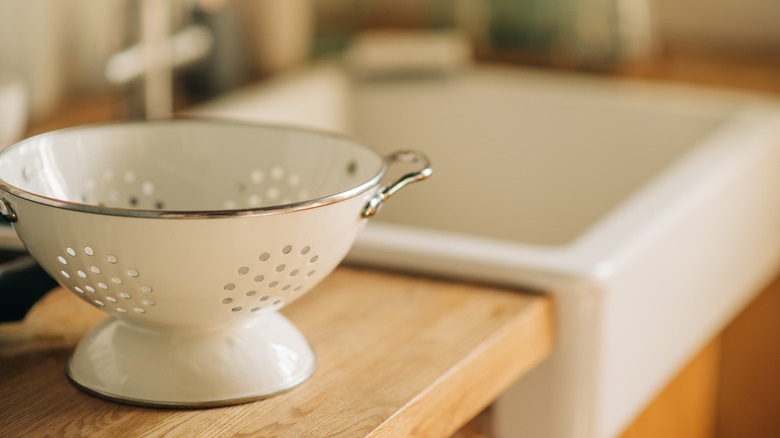 White colander on a kitchen counter