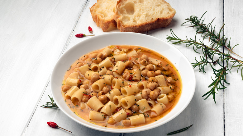 Bowl of pasta e ceci on white table