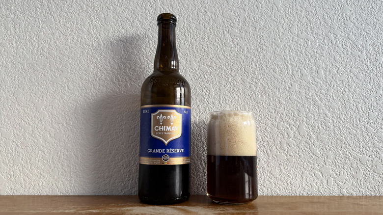 Chimay Grande Reserve Blue bottle beside a full glass