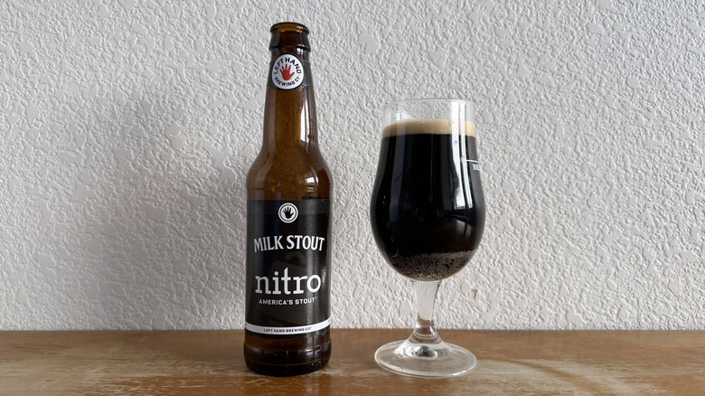 Left Hand Milk Stout bottle beside a full glass