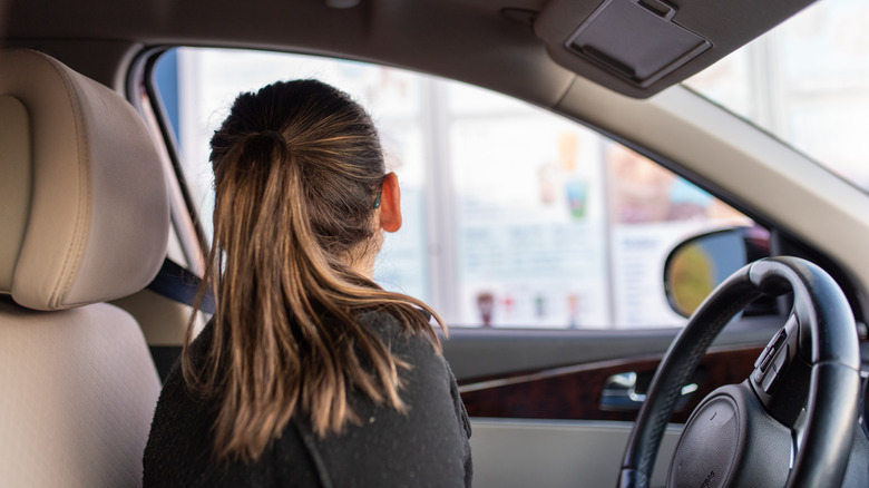 Woman ordering at a drive-thru