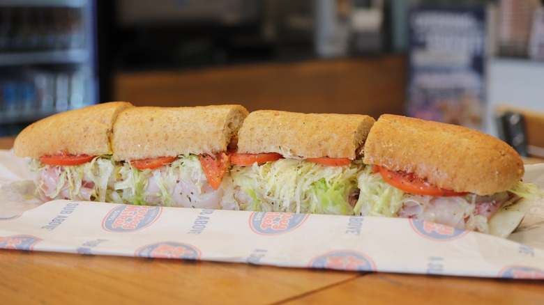 A long Jersey Mike's sandwich cut into 4 pieces.