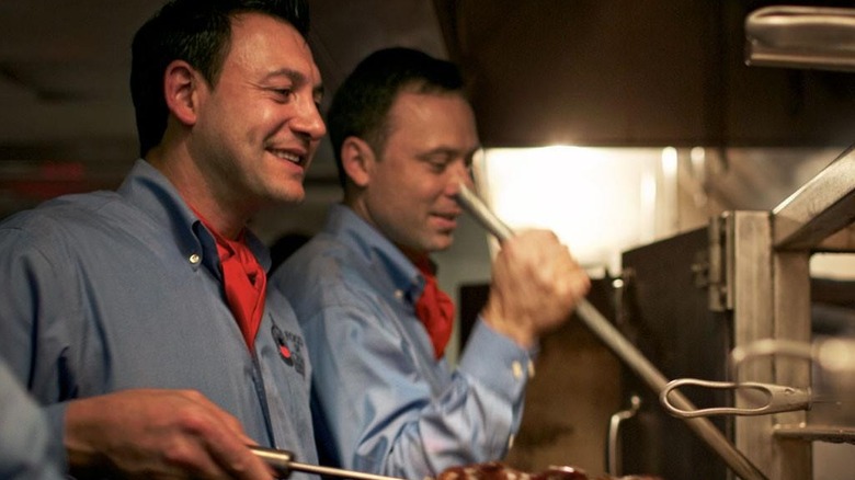 Two gauchos standing in the kitchen