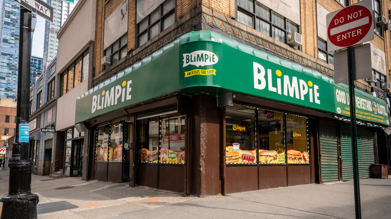 A Blimpie sandwich shop location on city street corner