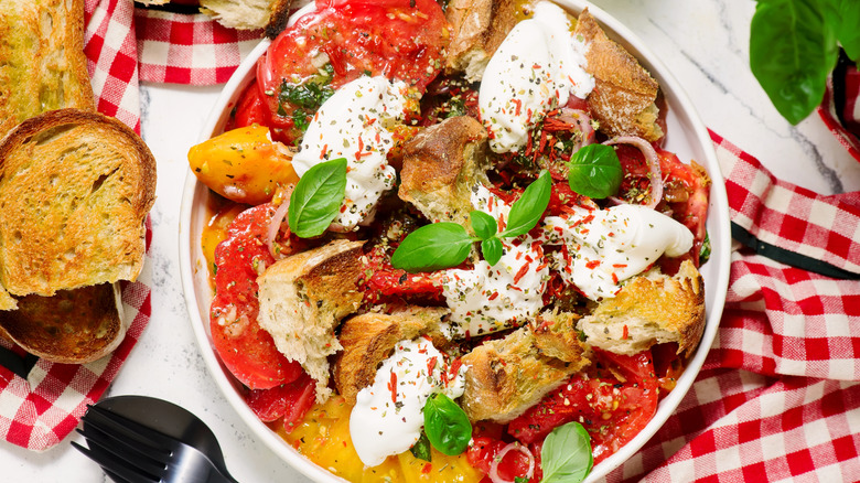 A salad with large bread croutons