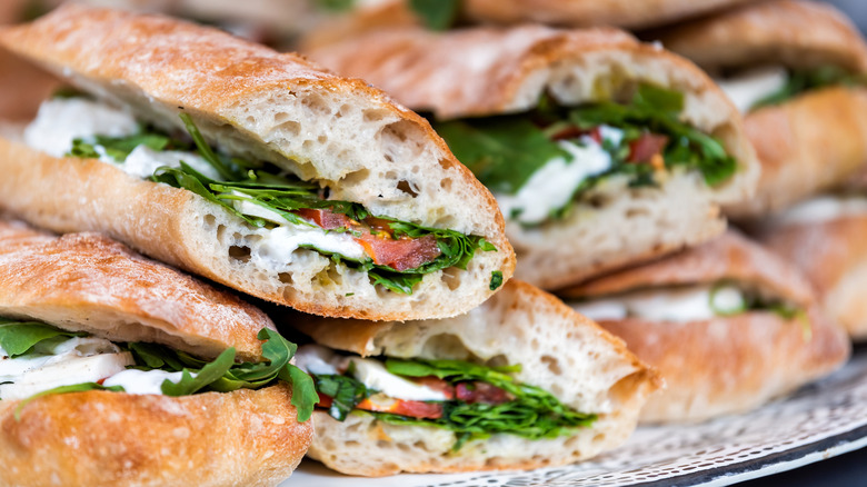 Stack of mozzarella and salad sandwiches