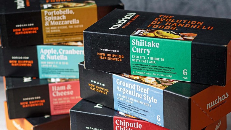 stacks of Nuchas empanadas boxes