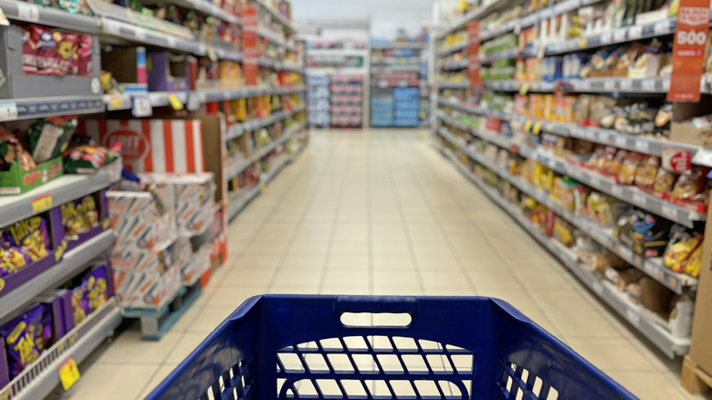 grocery cart going down a store aisle