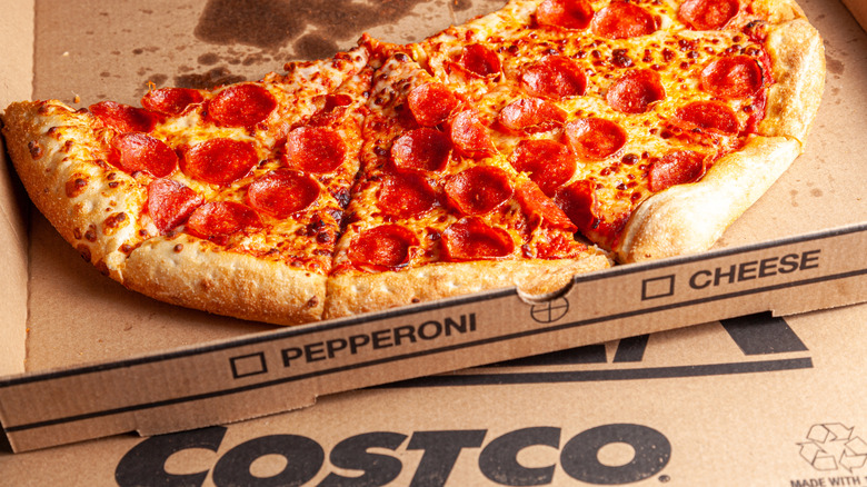 half a pepperoni pizza in Costco pizza box