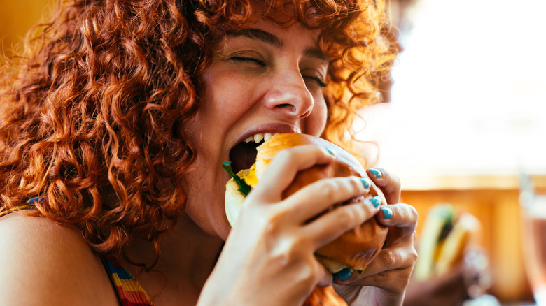 Woman eating burger