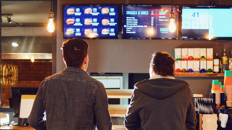 Two men at a counter