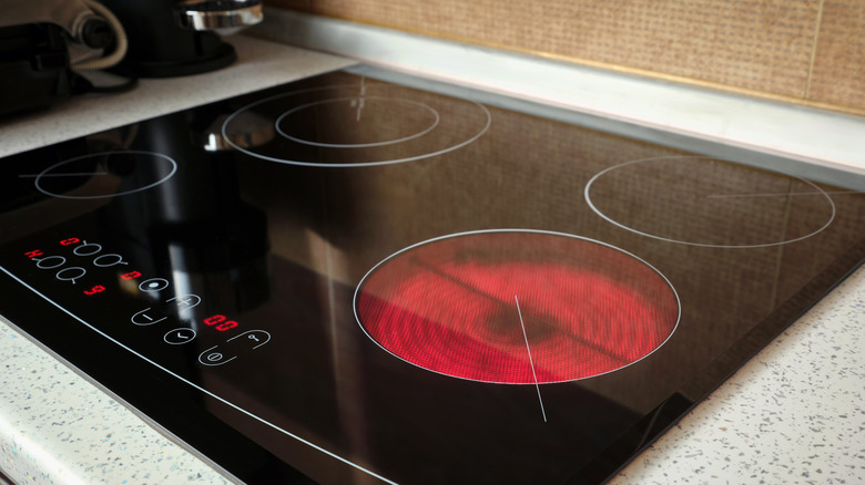 A coil electric stove with a burner on