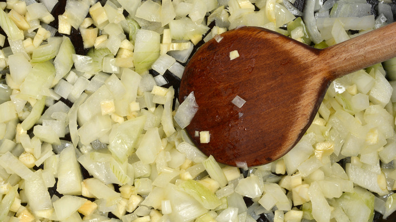 Chopped onions and garlic getting sautéed