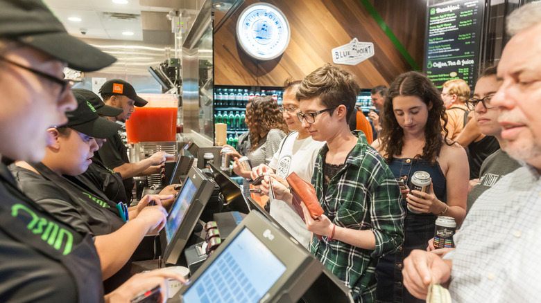 Customers order at the Shake Shack cash register.