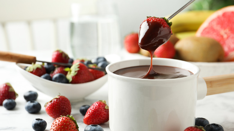 Strawberry dipped in chocolate fondue