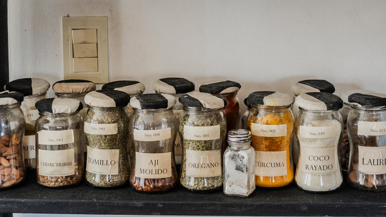 Labeled jars of herbs and spices