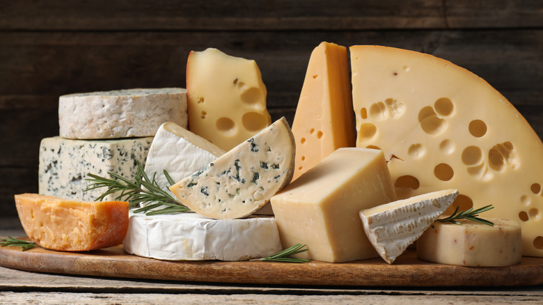 Selection of cheeses piled onto a board